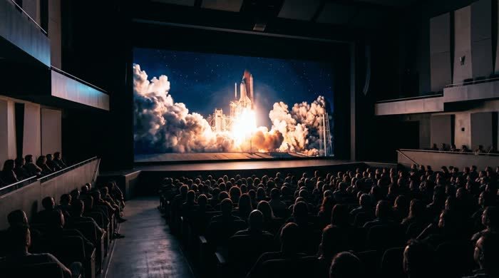 Massive indoor LED wall showing cinematic content