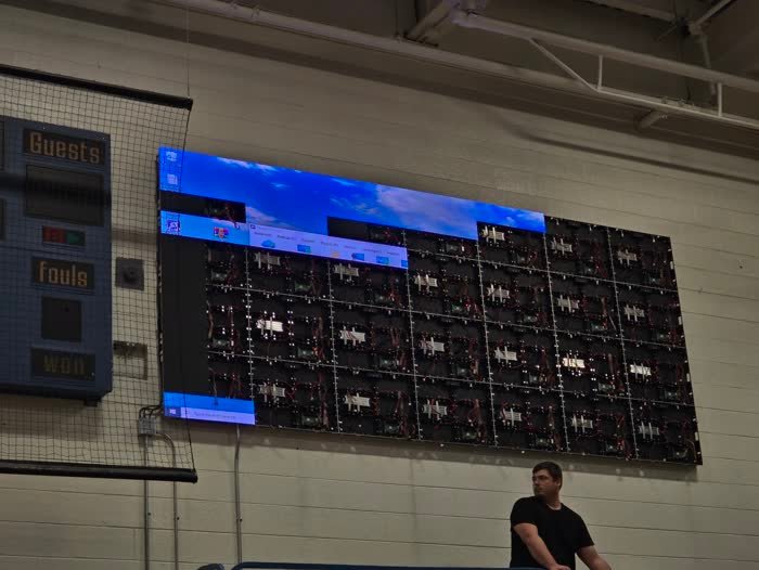 Panels partially installed on gym wall