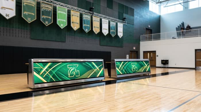 High school scorers tables in team colors